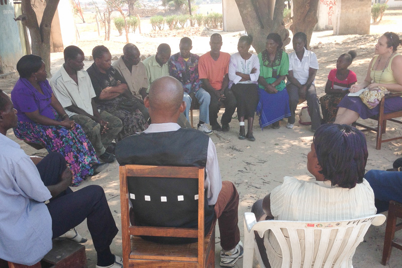 Annie Glover (far right) meets with Community Health Workers in Zambia's Choma District as part of her practicum work with Akros.