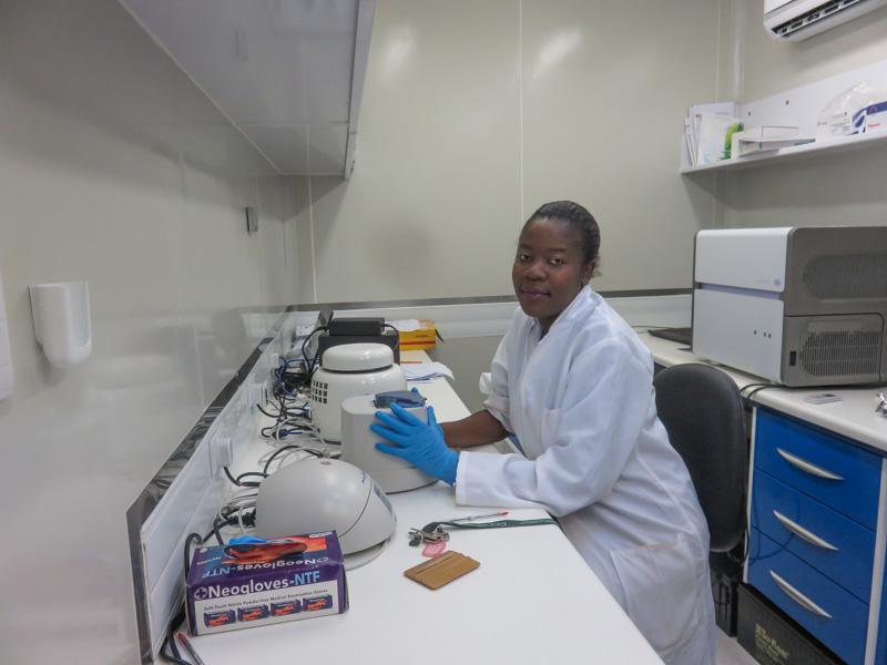 Mwenda spins the plate to prepare for PCR