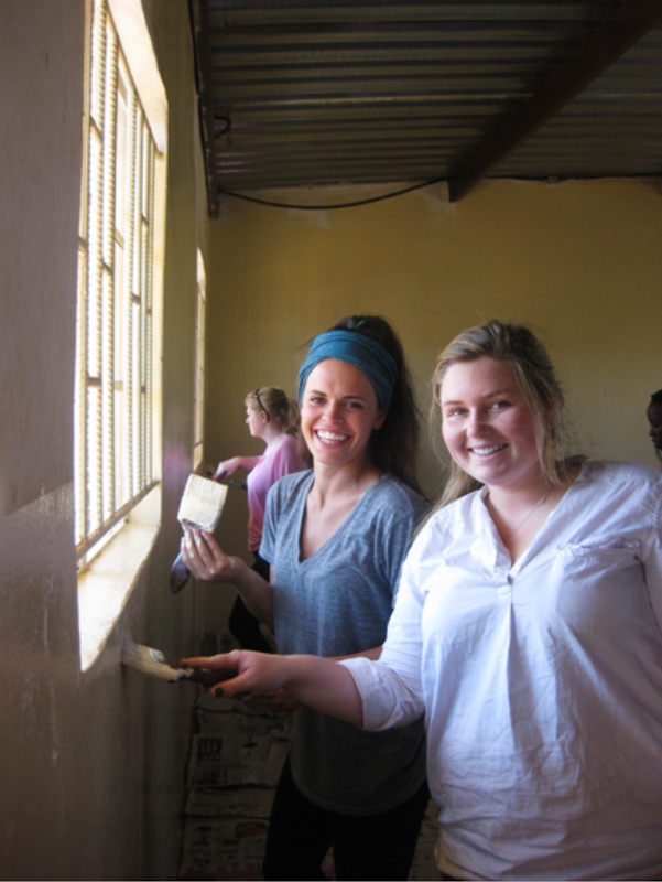 MSU students Lizza Redfern and Tory Evans painting a classroom at Mercy School.