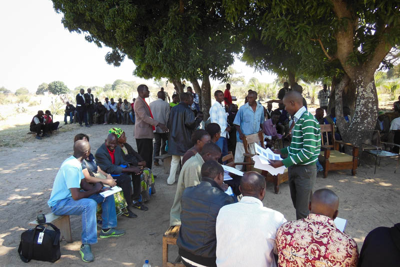 A group of traditional village leaders gathers for an orientation on community-led total sanitation.