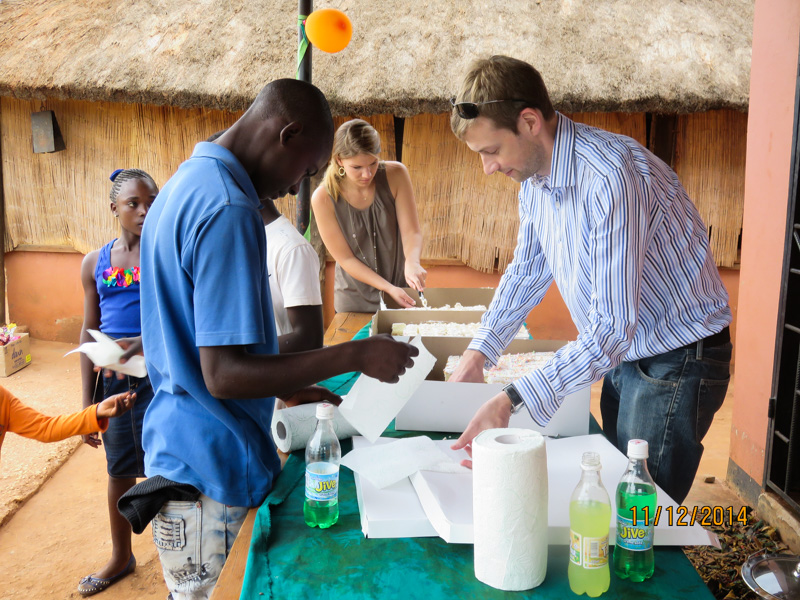 Akros staffers prepare a treat for the end of the meal.