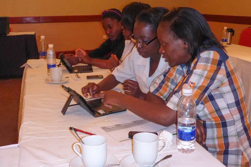 Training participants learn to use Android-based tablets.